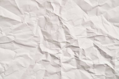 Kırışıklıkları olan beyaz buruşuk kağıt dokusu. Hasarlı ve yırtık çarşaf