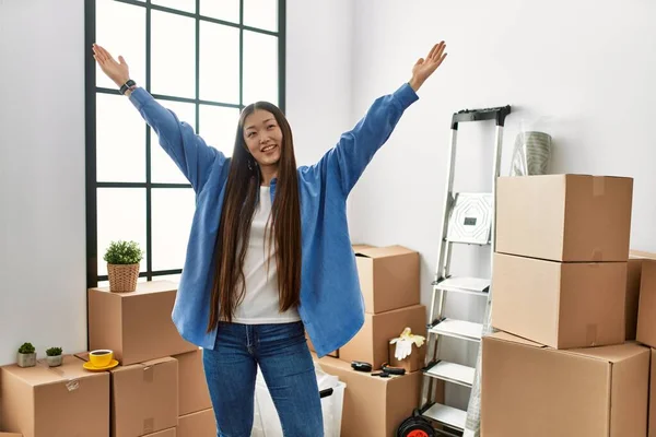 Young Chinese Girl Smiling Happy Confident Hands Raised New Home — Stock Photo, Image