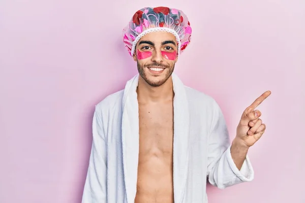 Young Hispanic Man Wearing Bathrobe Shower Cap Using Eyes Bags — Stock Photo, Image