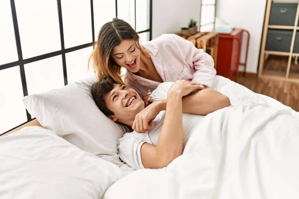 Young Caucasian Woman Smiling Happy Waking Her Boyfriend Tickle Bed — Stock Photo, Image