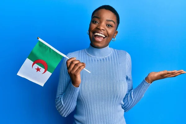 Young African American Woman Holding Algeria Flag Celebrating Achievement Happy — Stock Photo, Image