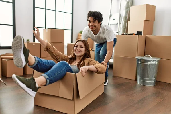 Young Couple Smiling Happy Playing Cardboard Box Car New Home — Stock Photo, Image