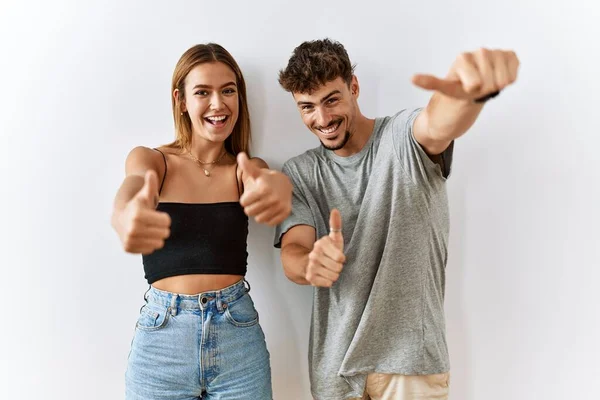 Young Beautiful Couple Standing Together Isolated Background Approving Doing Positive — 图库照片