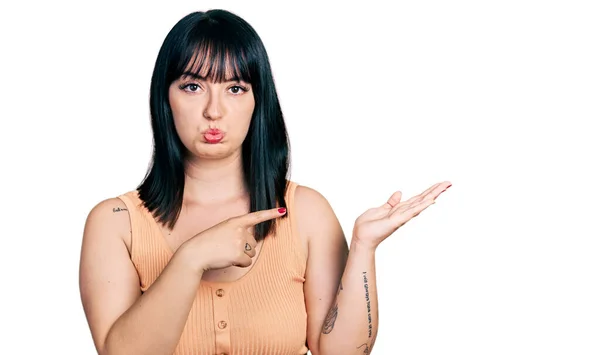Young Hispanic Size Woman Pointing Open Palm Finger Depressed Worry — Stock Photo, Image