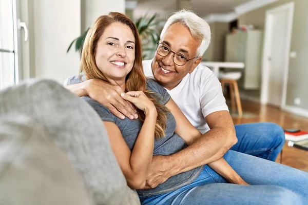 Middle Age Hispanic Couple Smiling Happy Hugging Sitting Sofa Home — Stock Photo, Image