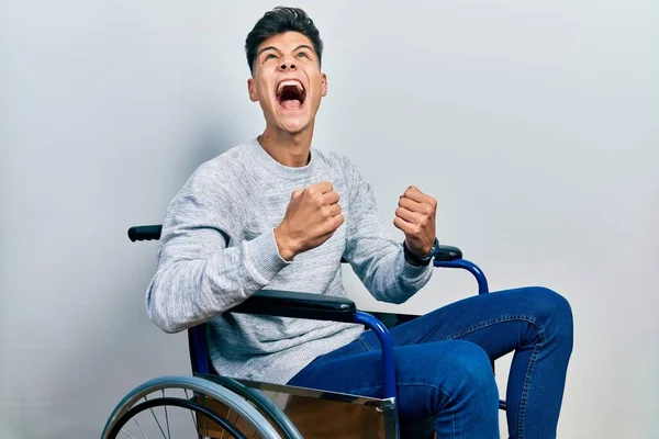 Young Hispanic Man Sitting Wheelchair Angry Mad Screaming Frustrated Furious — Stock Photo, Image