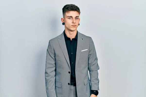 Young Caucasian Boy Ears Dilation Wearing Business Jacket Looking Sleepy — Stock Photo, Image