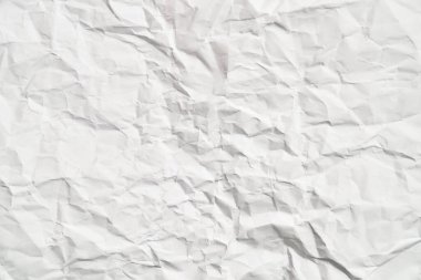 Kırışıklıkları olan beyaz buruşuk kağıt dokusu. Hasarlı ve yırtık çarşaf