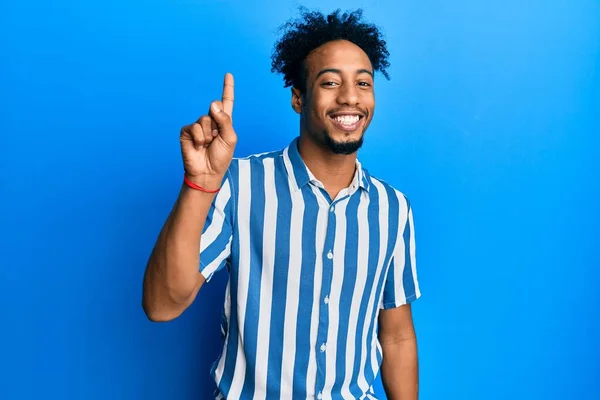 Young African American Man Beard Wearing Casual Striped Shirt Showing — Stock Photo, Image