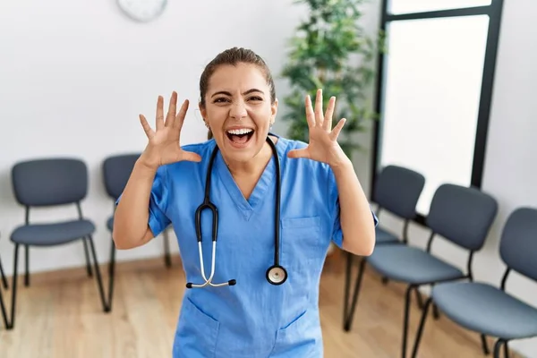 Young Brunette Doctor Woman Waiting Room Celebrating Victory Happy Smile — Stock Photo, Image
