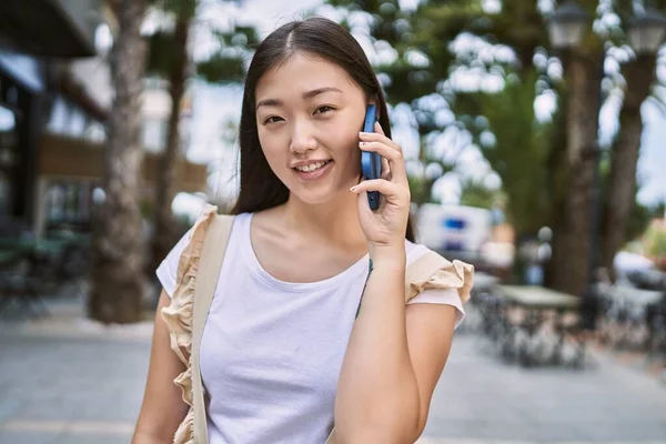 Young Chinese Girl Smiling Happy Talking Smartphone City — Stock Photo, Image