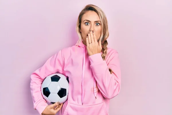 Beautiful Young Blonde Woman Holding Soccer Ball Covering Mouth Hand — Stock Photo, Image