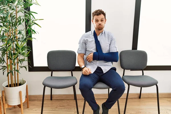 Handsome Young Man Sitting Doctor Waiting Room Arm Injury Puffing — Stock Photo, Image