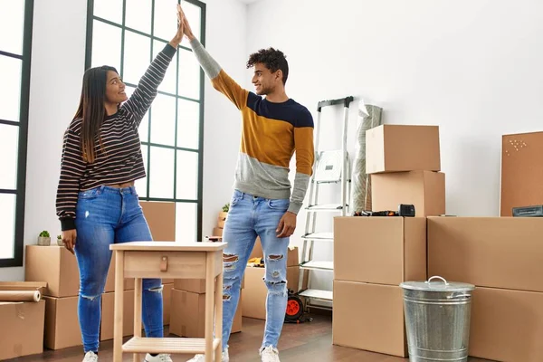 Young Latin Couple Smiling Happy Assembling Piece Furniture New Home — Foto de Stock