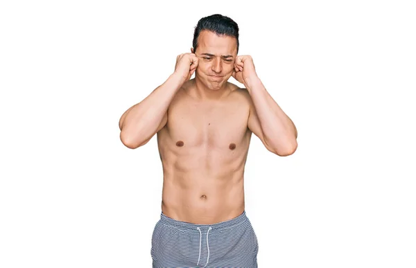 Handsome Young Man Wearing Swimwear Shirtless Covering Ears Fingers Annoyed — Stock Photo, Image