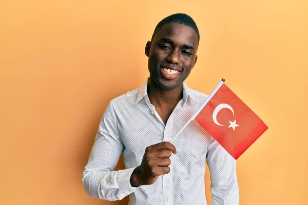 Young African American Man Holding Turkey Flag Looking Positive Happy — Stock Photo, Image