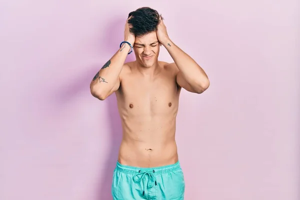 Young Hispanic Man Wearing Swimwear Shirtless Suffering Headache Desperate Stressed — Stock Photo, Image
