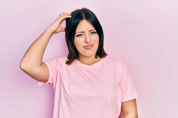 Young Hispanic Woman Wearing Casual Pink Shirt Confuse Wonder Question — Stock Photo, Image