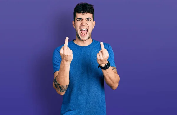 Young Hispanic Man Wearing Casual Shirt Showing Middle Finger Doing — Stockfoto