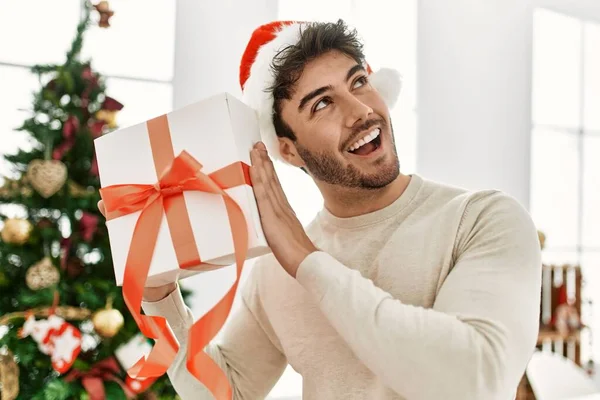 Young Hispanic Man Smiling Happy Holding Gift Home — Stock Photo, Image