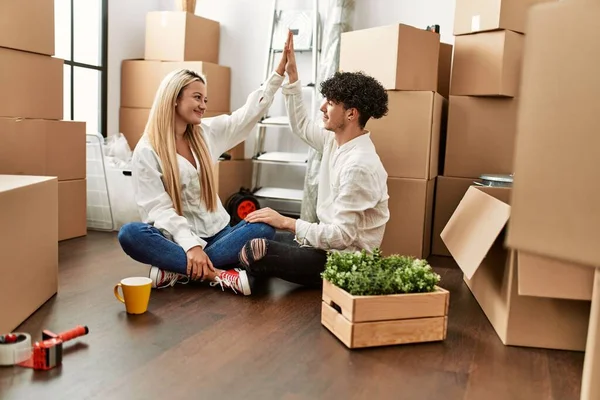 Young Beautiful Couple Smiling Happy Celebrating Hands Raised New Home — Stock Photo, Image