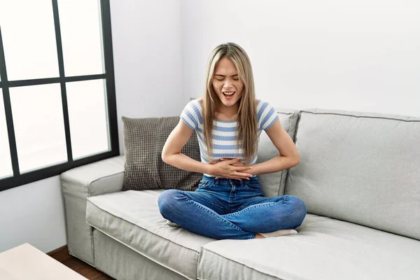 Asian Young Woman Sitting Sofa Home Hand Stomach Because Indigestion — Stock Photo, Image