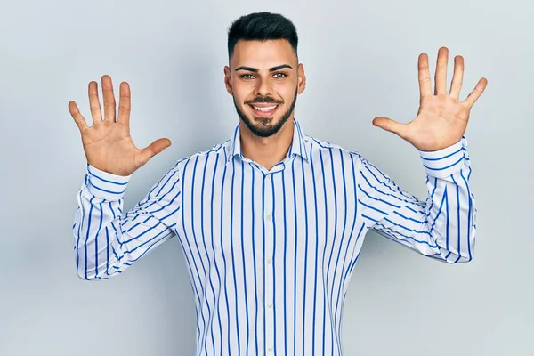 Young Hispanic Man Beard Wearing Casual Striped Shirt Showing Pointing — Stock Photo, Image