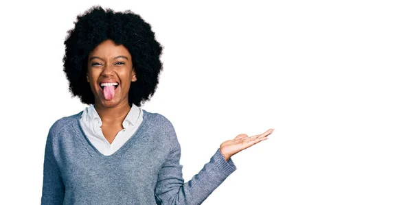 Young African American Woman Presenting Open Palm Sticking Tongue Out — Stock Photo, Image