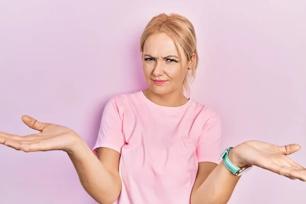 Young Blonde Woman Wearing Casual Pink Shirt Clueless Confused Open — Stock Photo, Image