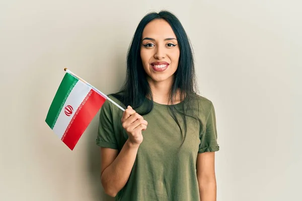 Young Hispanic Girl Holding Iran Flag Looking Positive Happy Standing — Stock Photo, Image