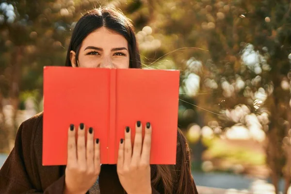 Young Hispanic Woman Smiling Happy Covering Face Book City — Stock Photo, Image