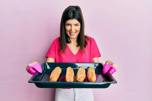 Young Hispanic Woman Holding Homemade Bread Smiling Laughing Hard Out — Stock Photo, Image