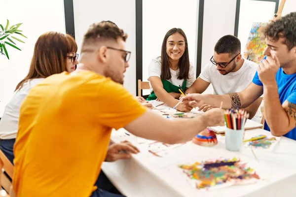 Group of people drawing at art studio.