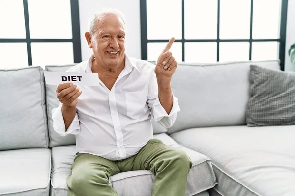 Senior Man Holding Diet Banner Smiling Happy Pointing Hand Finger — Stock fotografie
