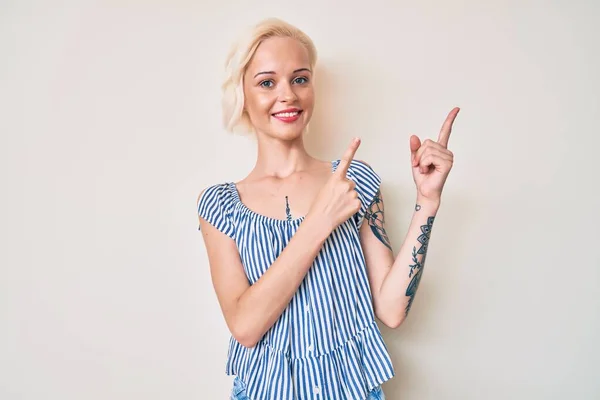 Blond tattooed girl fingers on cam