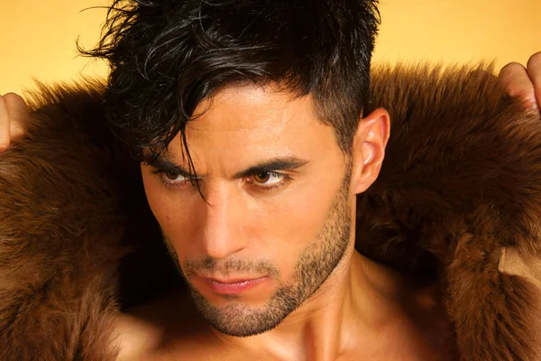 Portrait of a caucasian young man with fur — Stock Photo, Image