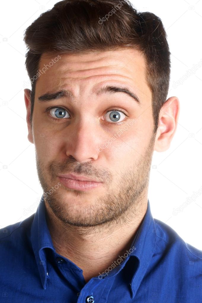 Young man making a funny face over a white background Stock Photo by ©citylights 56559615 Young man making a funny face over a white background Stock Photo by ©citylights 56559615