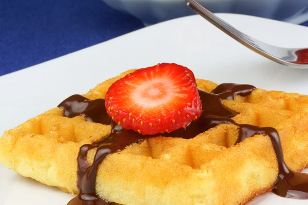 Waffle with strawberry and chocolate sauce — Stock Photo, Image