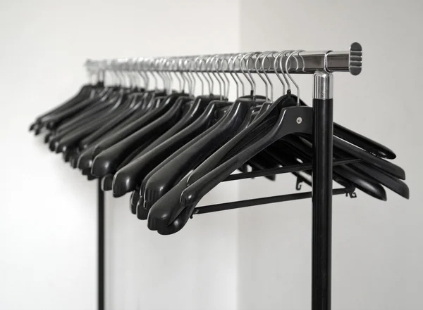 Stand with clothes hangers — Stock Photo, Image
