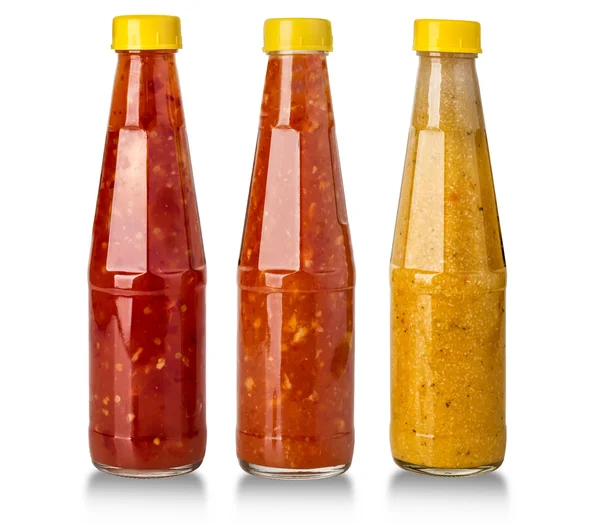 Barbecue sauces in glass bottles — Stock Photo, Image