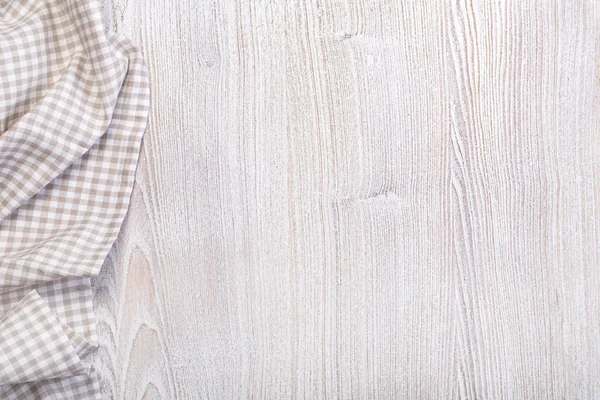 Tafelkleed op houten tafel — Stockfoto