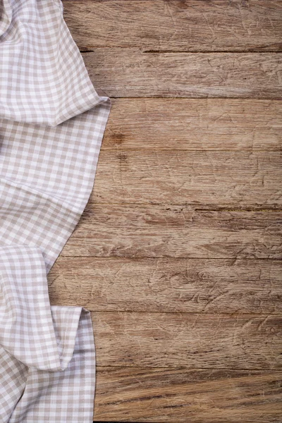 Tablecloth on wooden table — Stock Photo, Image