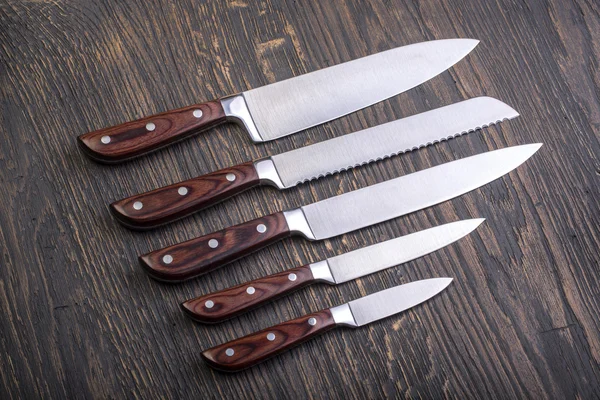 Kitchen knifes on  board — Stock Photo, Image