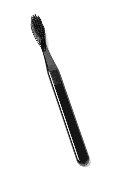 白い背景に隔離された黒い歯ブラシ — ストック写真
