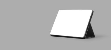 Gri arkaplanda kırpma yolu ile izole edilmiş bir tablet