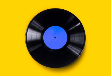 Vinyl record on a colored background. Old vintage vinyl record isolated clipart