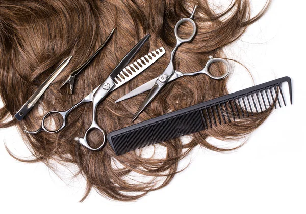 Long brown hair with scissors — Stock Photo, Image