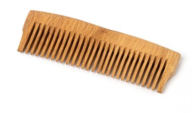 Wooden comb presenting natural texture on a white background