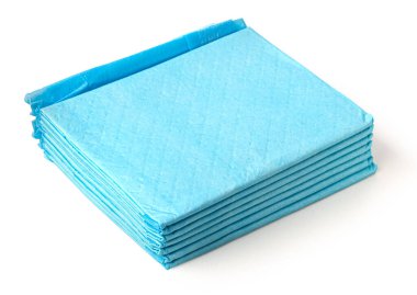 Bir yığın mavi emici ped hayvan hijyeni ve köpek evi eğitimini kolaylaştırıyor.