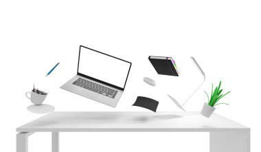 Beyaz arka planda bilgisayar ve ofis malzemeleri olan modern işyeri